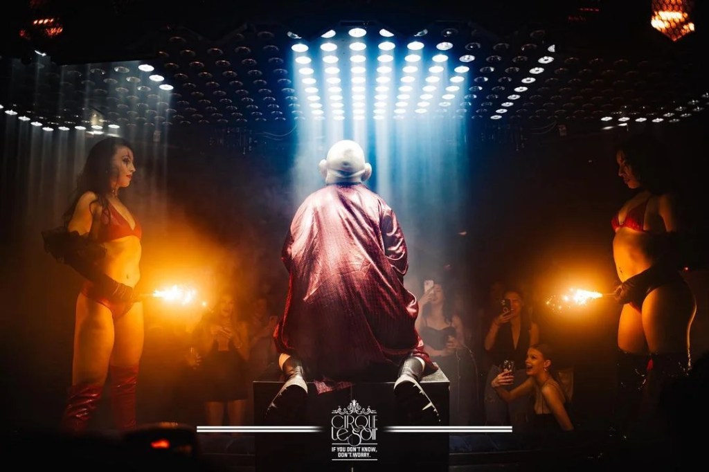 Guests with a Cirque Le Soir booking enjoying one of the Cirque Club shows.