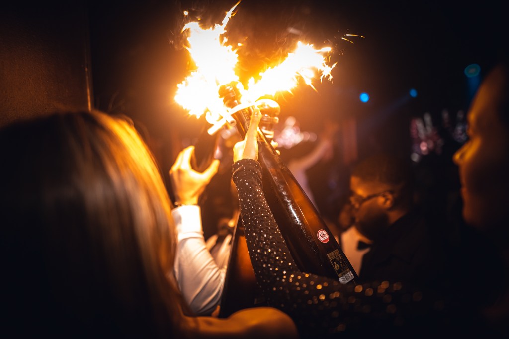 Champagne show inside a luxury nightclub in Mayfair, London.